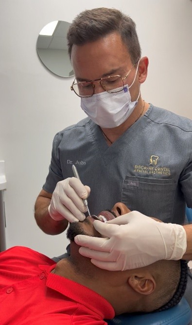 Miami dentist on Biscayne Boulevard working on a patient
